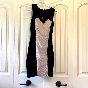Mini Bebe Dress with front and back cutouts.
